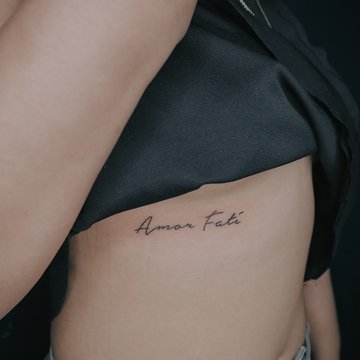 татуювання "Amor Fati"