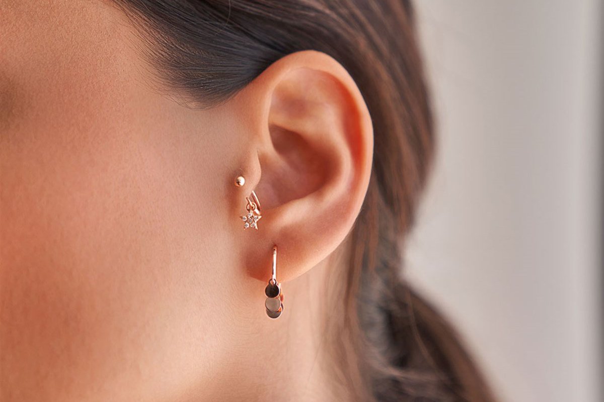 Прокол уха - трагус